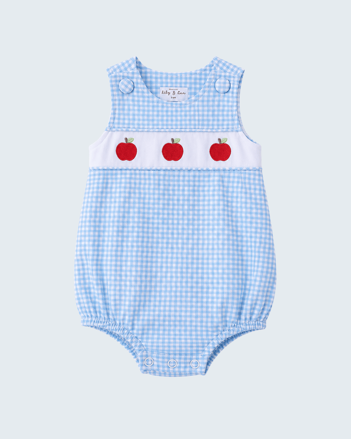 Light blue gingham smocked bubble romper with red apple print and button shoulder straps