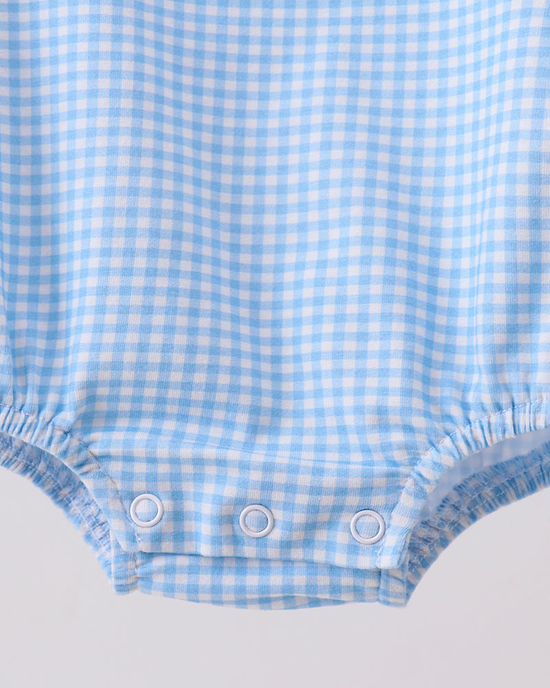 Light blue gingham bubble romper with three-snap closure at leg opening and gathered hem