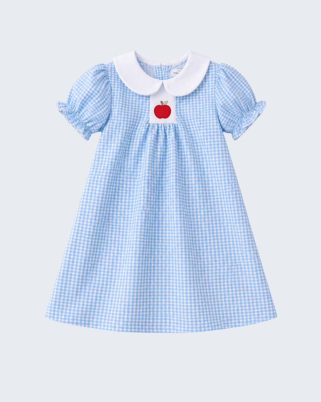 Light blue gingham smocked dress with white Peter Pan collar, puff sleeves, red apple