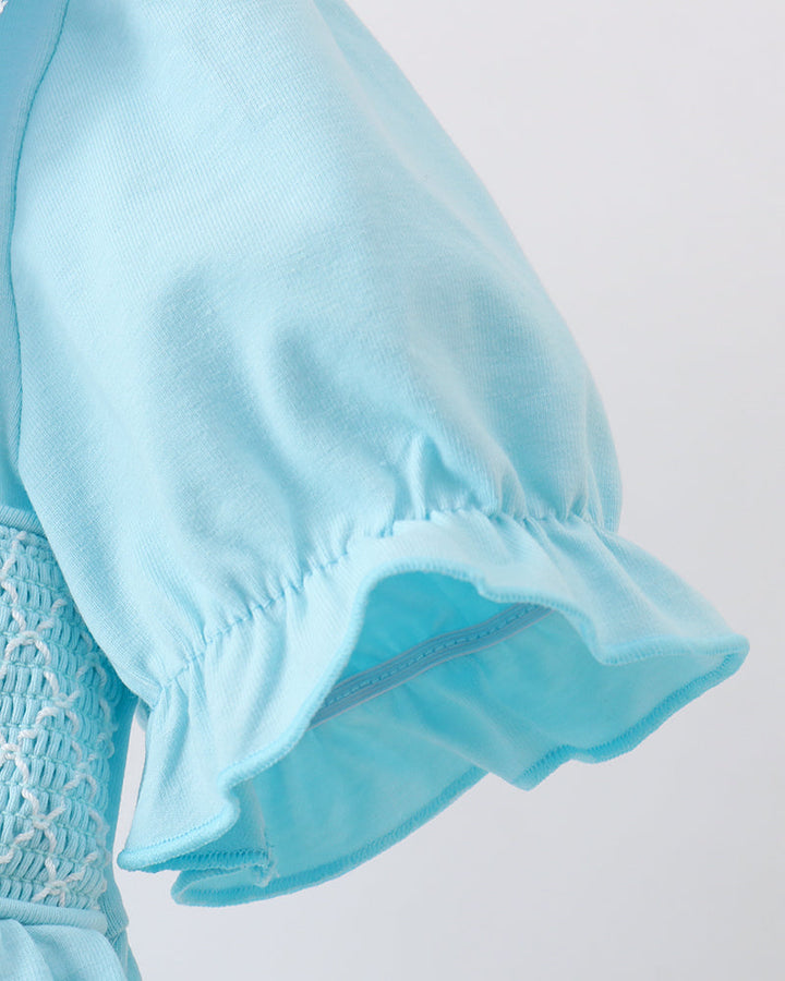 Light blue smocked lace dress with scalloped lace trim and flutter sleeve