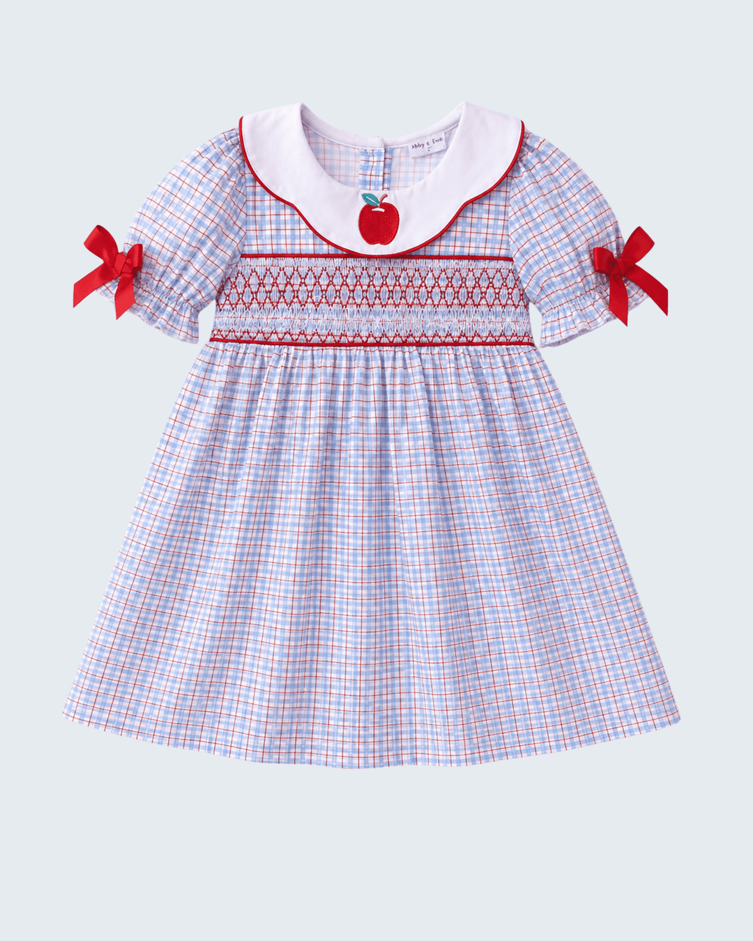 Blue Apple Smocked Plaid Dress on light grey background