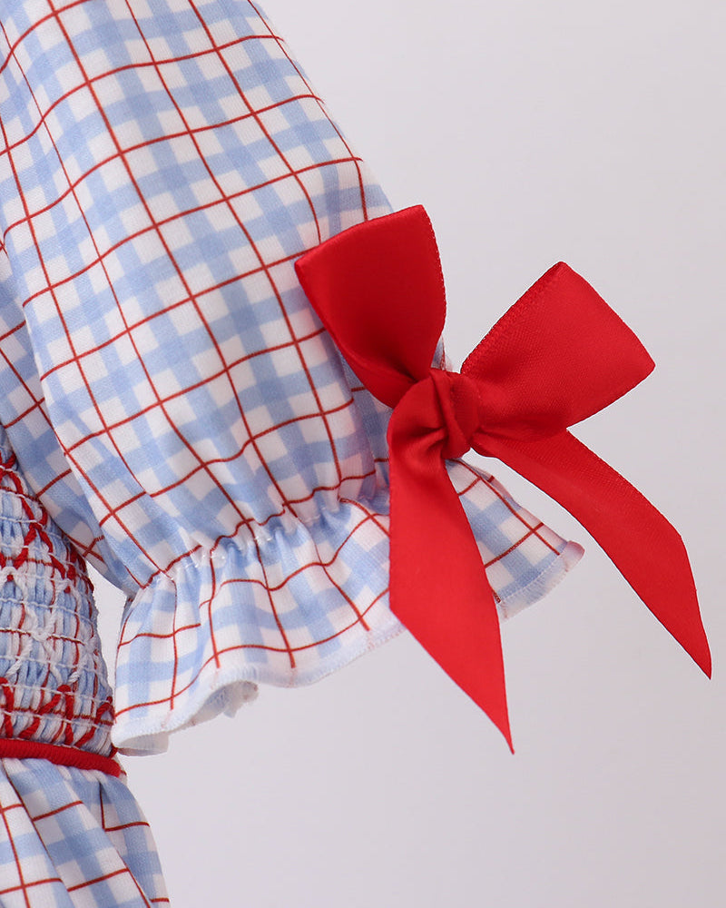 Plaid sleeve with red bow