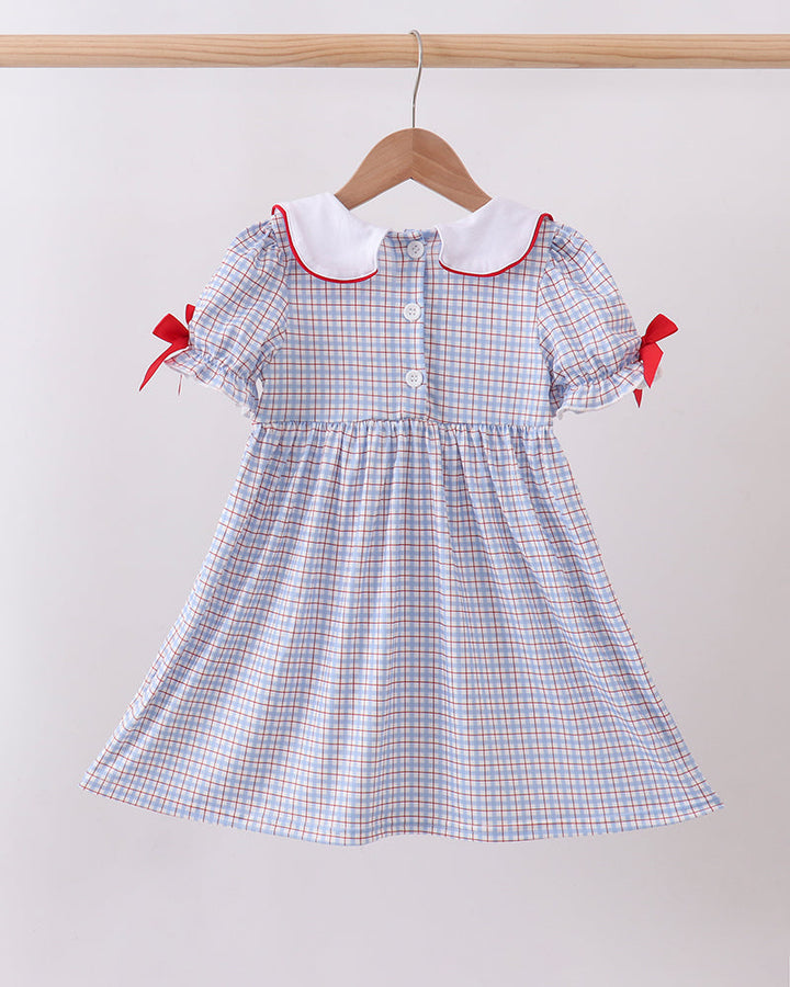 Blue Apple Smocked Plaid Dress on wooden hanger