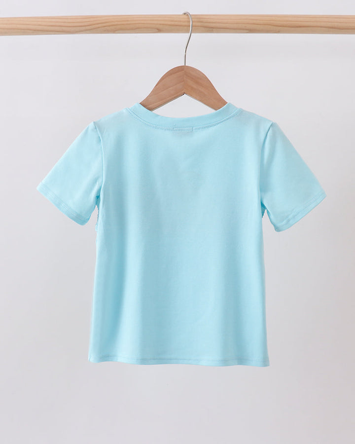 Light blue short-sleeve top on wooden hanger