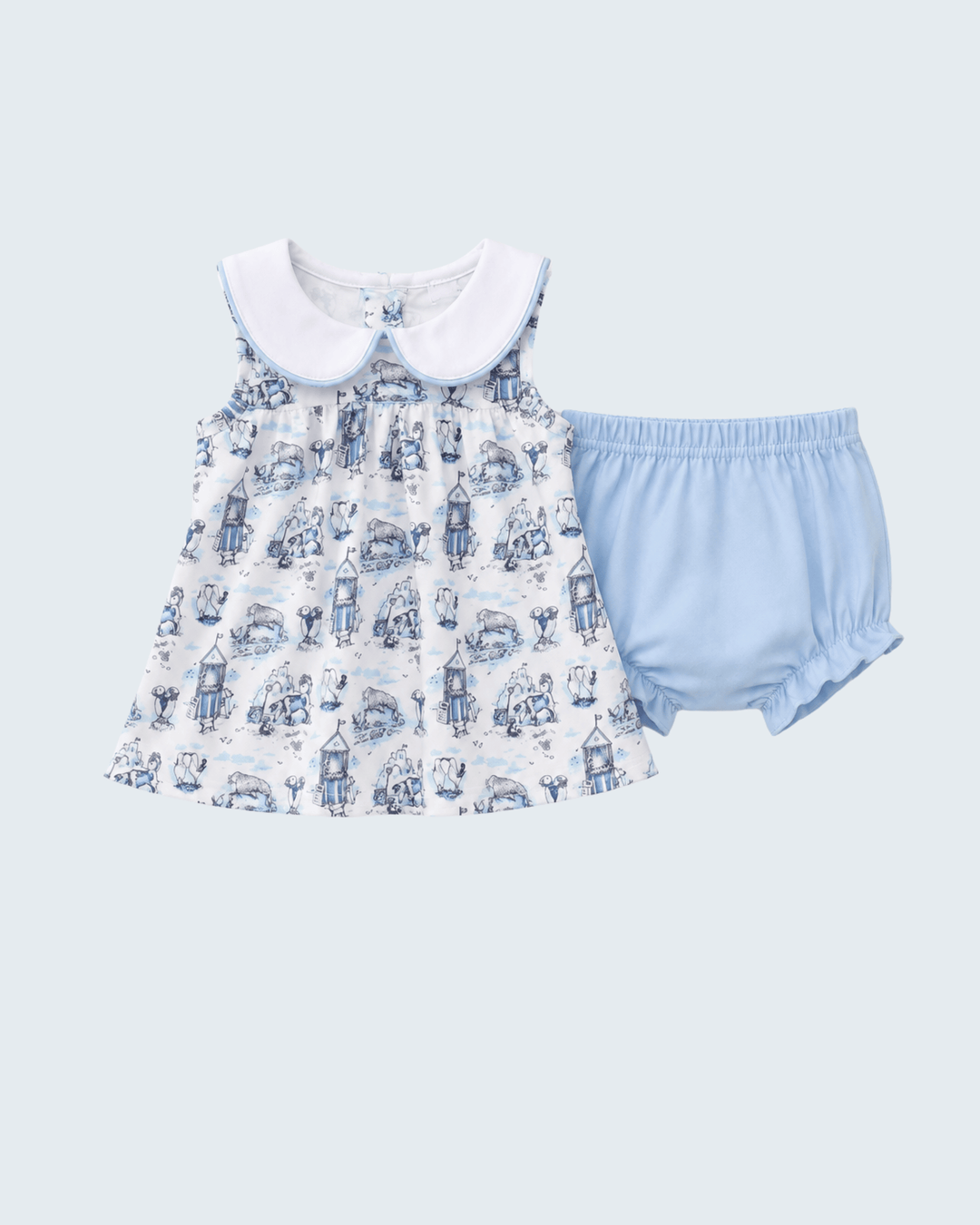 Baby dress with white collar and blue shorts on a light gray background
