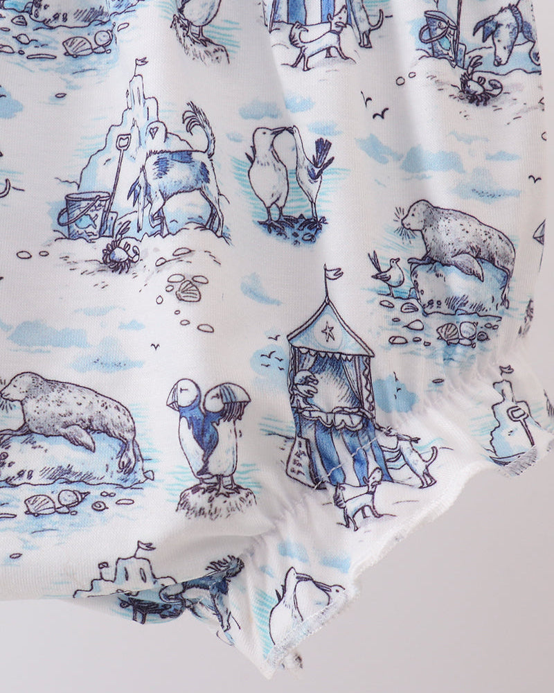 Fabric with blue and white animal print on a white background