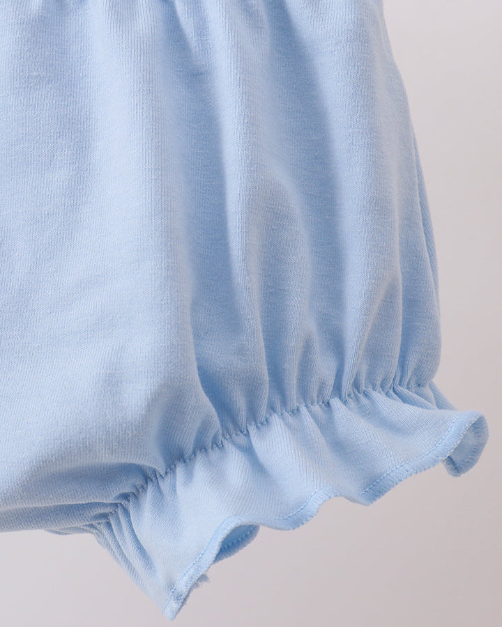 Light blue baby bloomers on a plain background