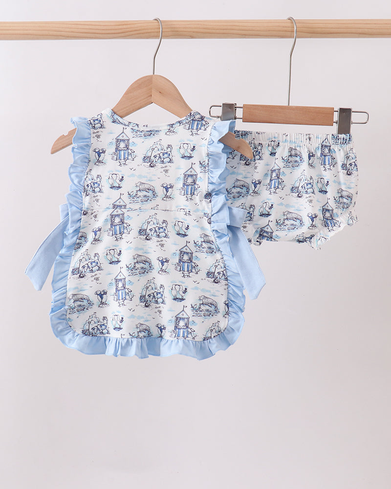 Baby romper with ruffles and car pattern on hangers against a light background