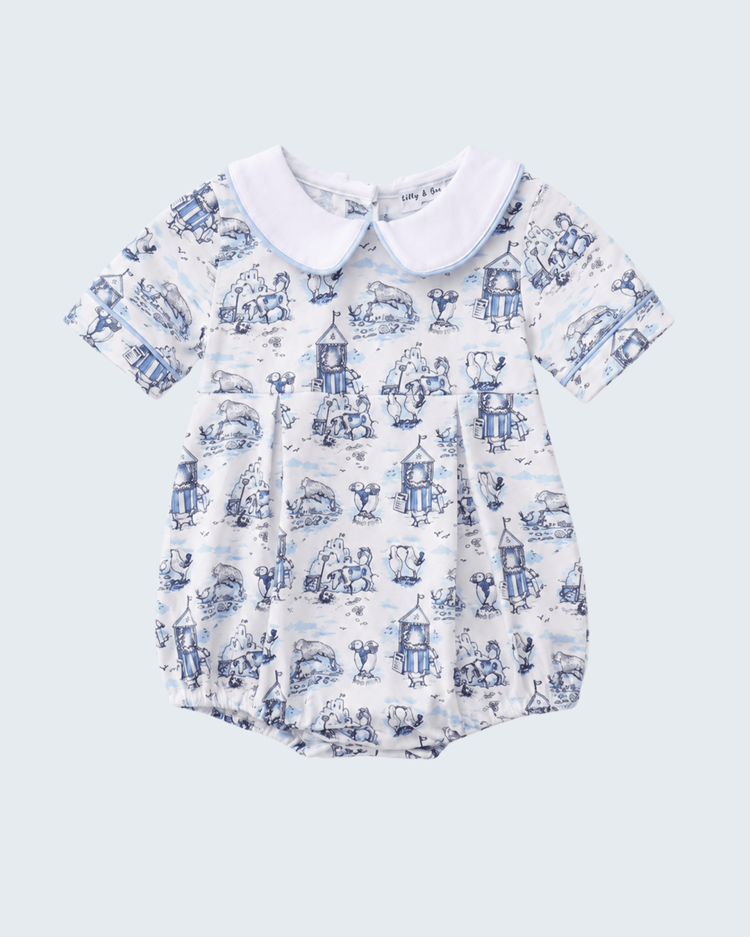 Baby romper with blue and white pattern on a light gray background