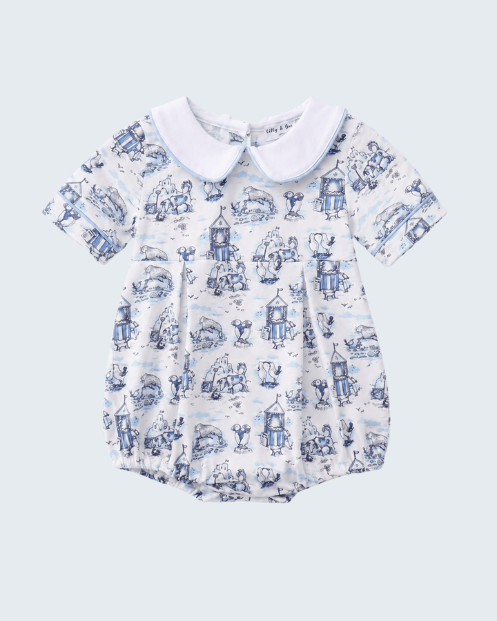 Baby romper with blue and white pattern on a light gray background