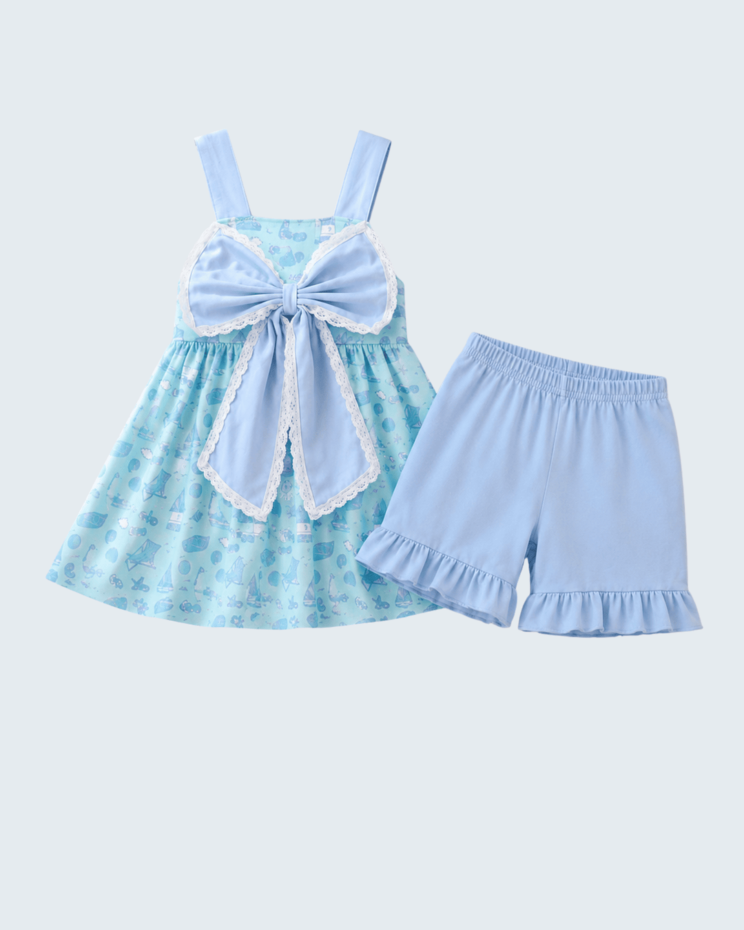 Children's outfit with a blue and green dress and matching shorts on a light blue background