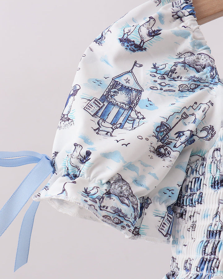 Swim set with blue and white pattern on a light gray background