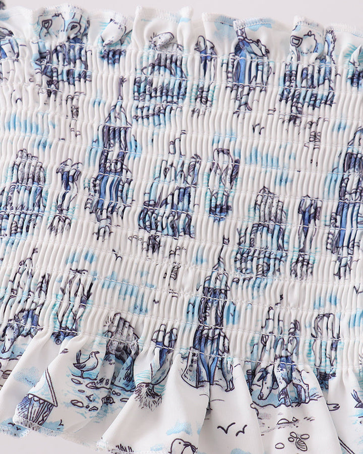 Close-up of fabric with blue and white pattern on a white background