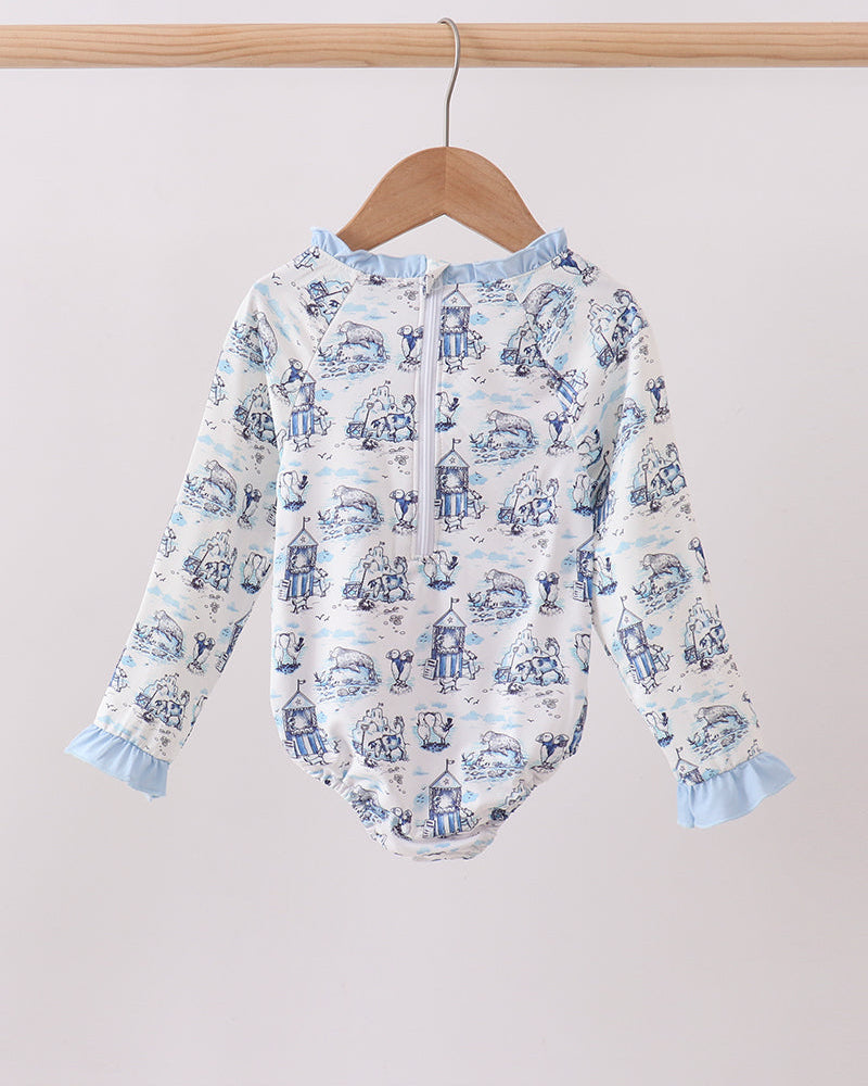 Rashguard with blue and white pattern on a wooden hanger against a light background