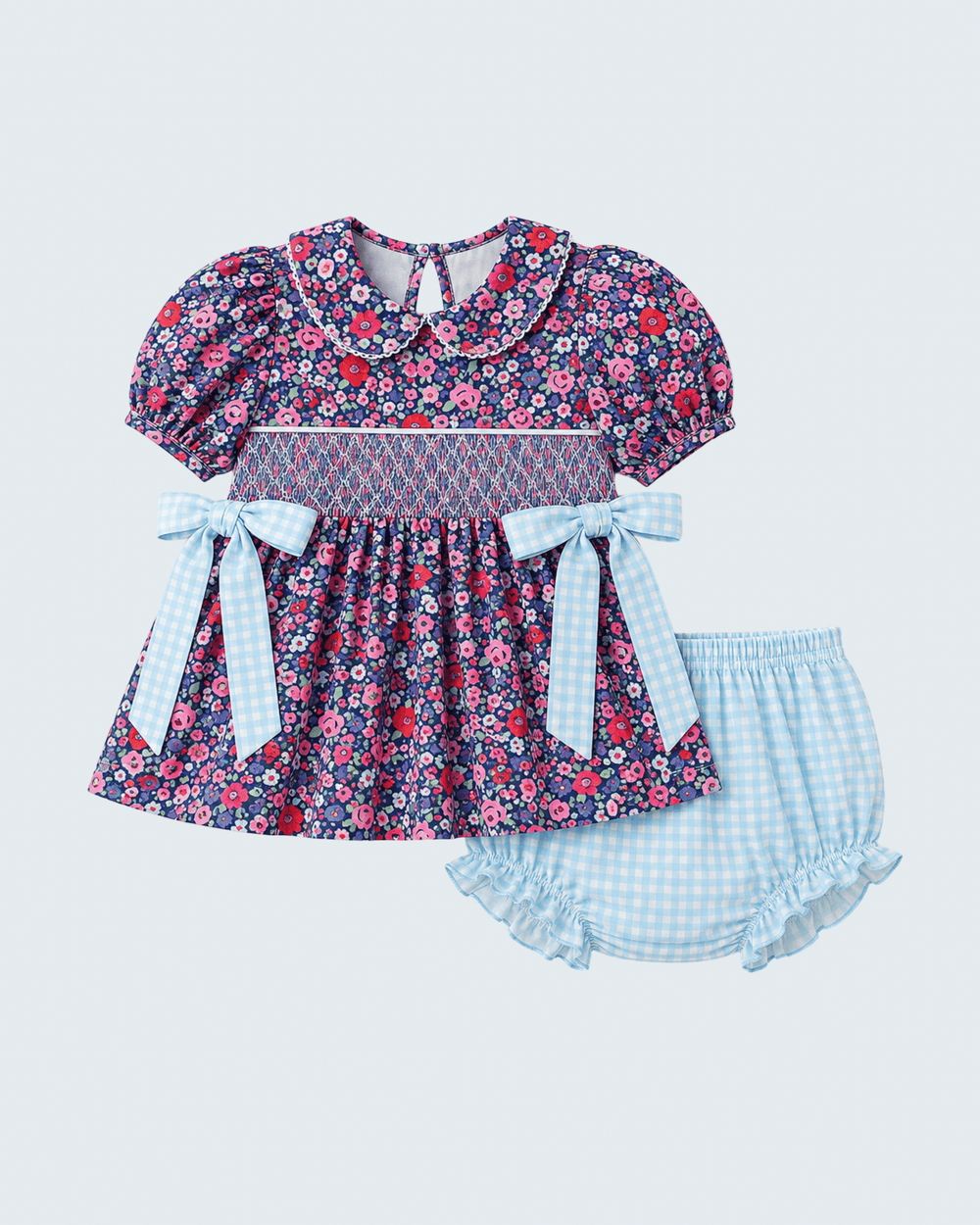 Floral smocked baby bloomer set with blue bow ties and matching gingham shorts