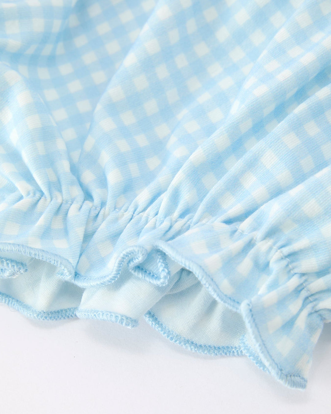 Light blue gingham bloomer with smocked waistband and ruffled hem