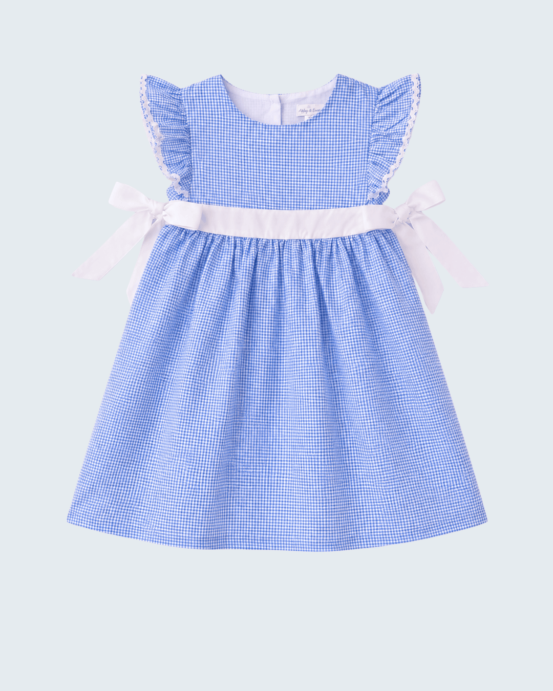 Blue checkered dress with white trim on a light gray background