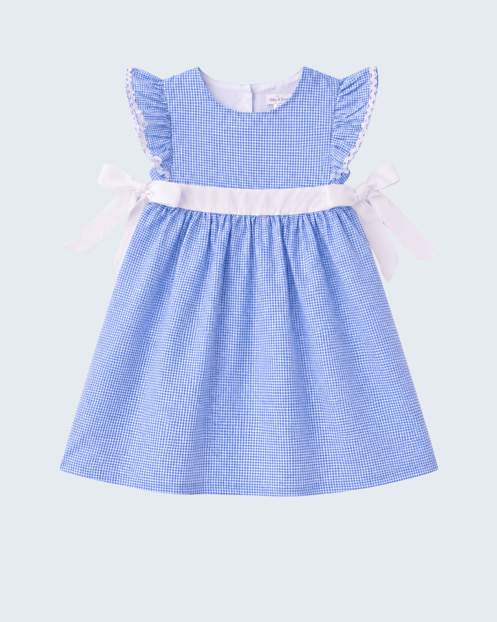 Blue checkered dress with white trim on a light gray background