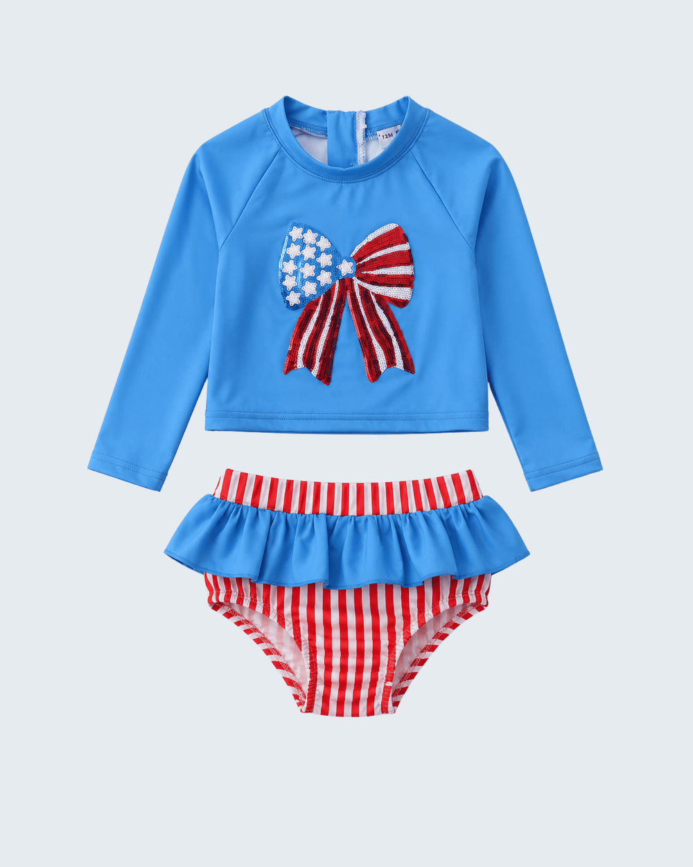 Children's two-piece swimsuit with blue top and red and white striped bottom on a light gray background