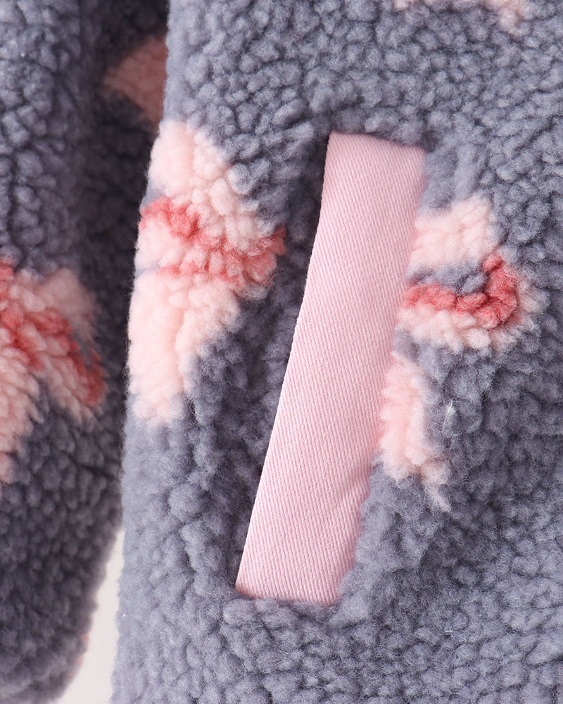 Sherpa fleece jacket sleeve detail with bow print and pink ribbed cuff