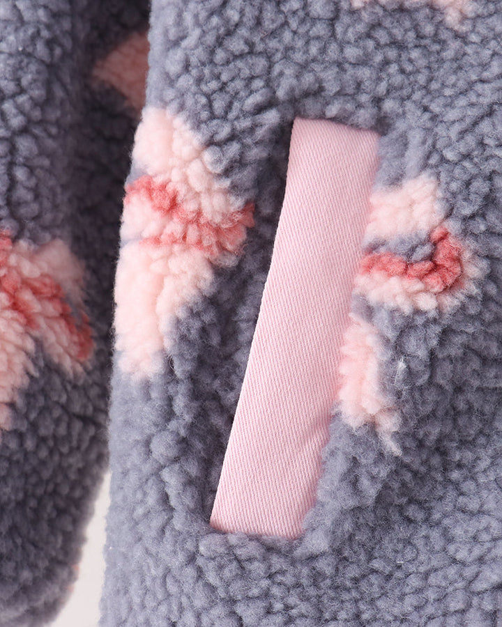 Sherpa fleece jacket sleeve detail with bow print and pink ribbed cuff