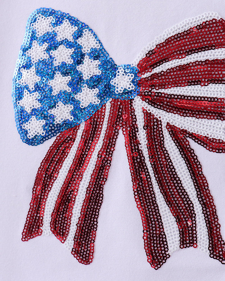 Beaded bow with American flag design on a white background