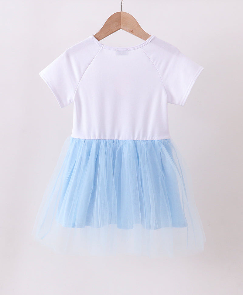 White top and light blue tulle skirt dress on a hanger against a white background