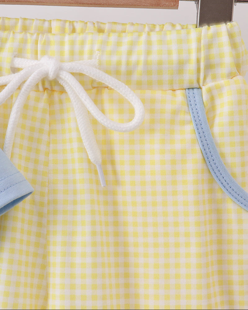 Yellow gingham shorts with white drawstring tie and light blue side trim