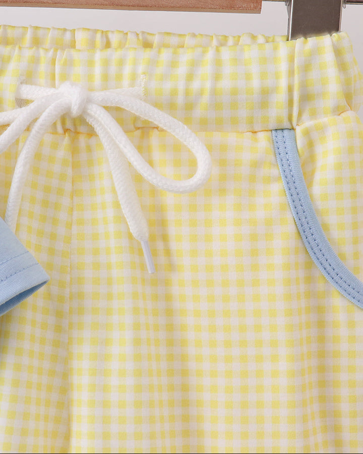 Yellow gingham shorts with white drawstring tie and light blue side trim