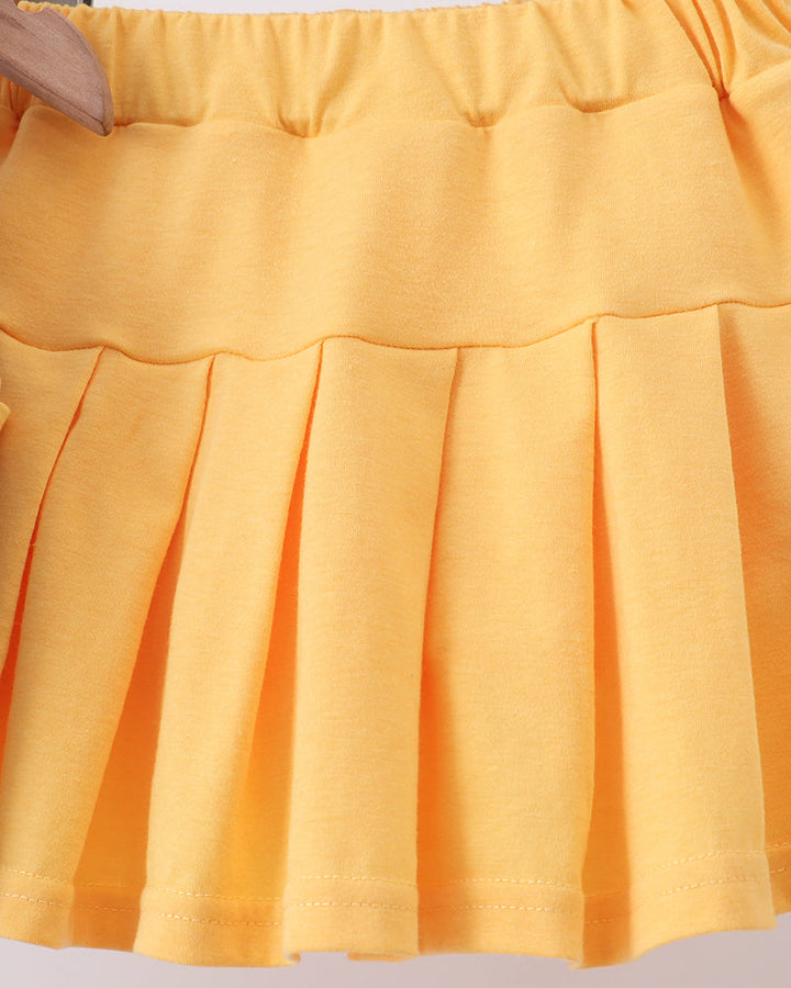 Yellow-orange ruffle skort with gathered waistband and tiered pleated skirt