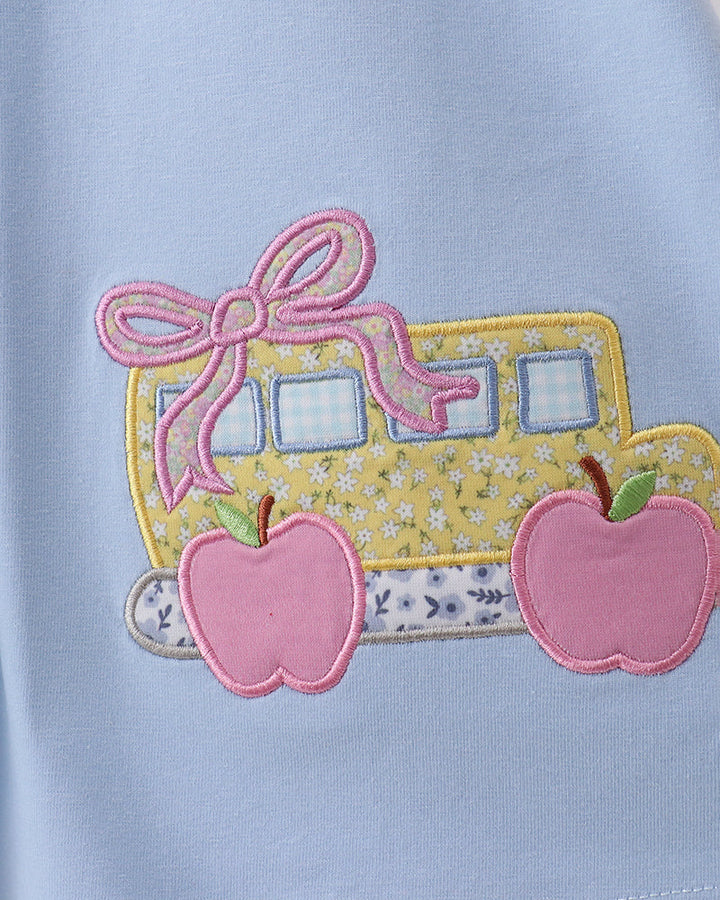 Blue dress with floral bus applique and pink apple patches
