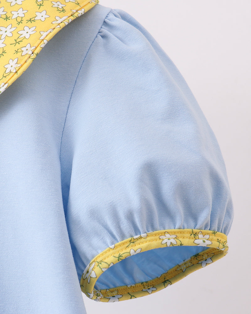 Light blue dress sleeve with yellow floral cuff trim