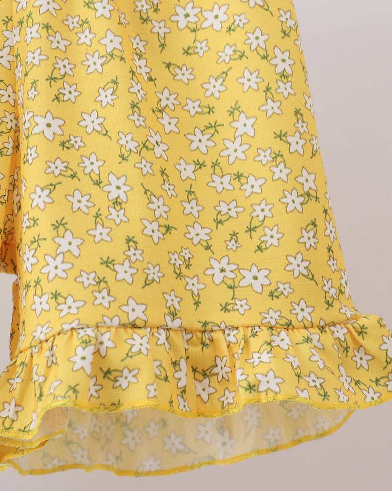 Girls yellow floral ruffle skirt with white flower print and sheer hem trim