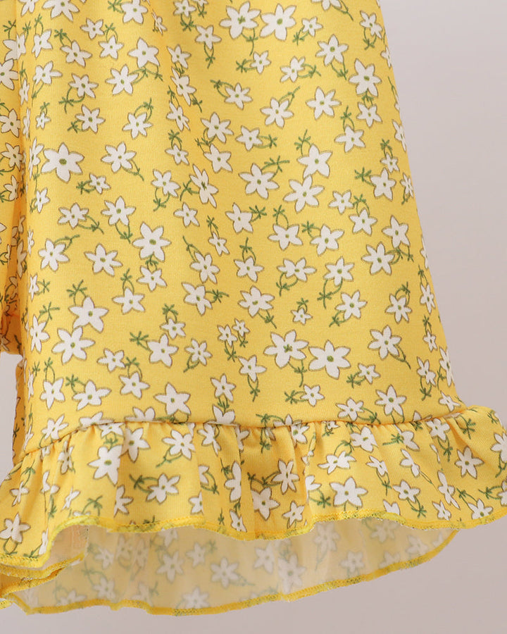 Girls yellow floral ruffle skirt with white flower print and sheer hem trim