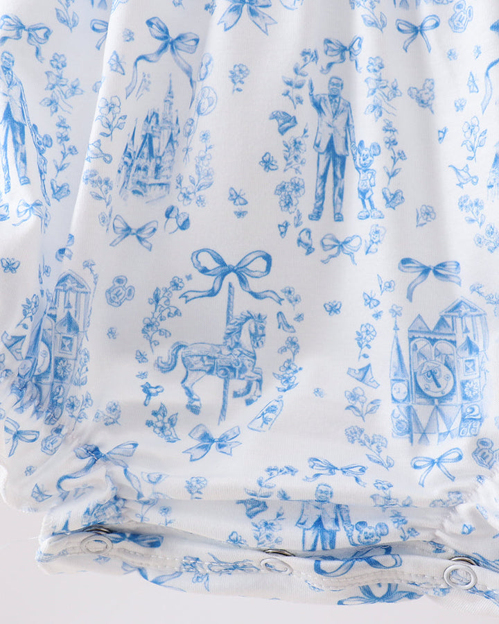 White fabric with blue vintage-style pattern featuring horses, houses, and bows.