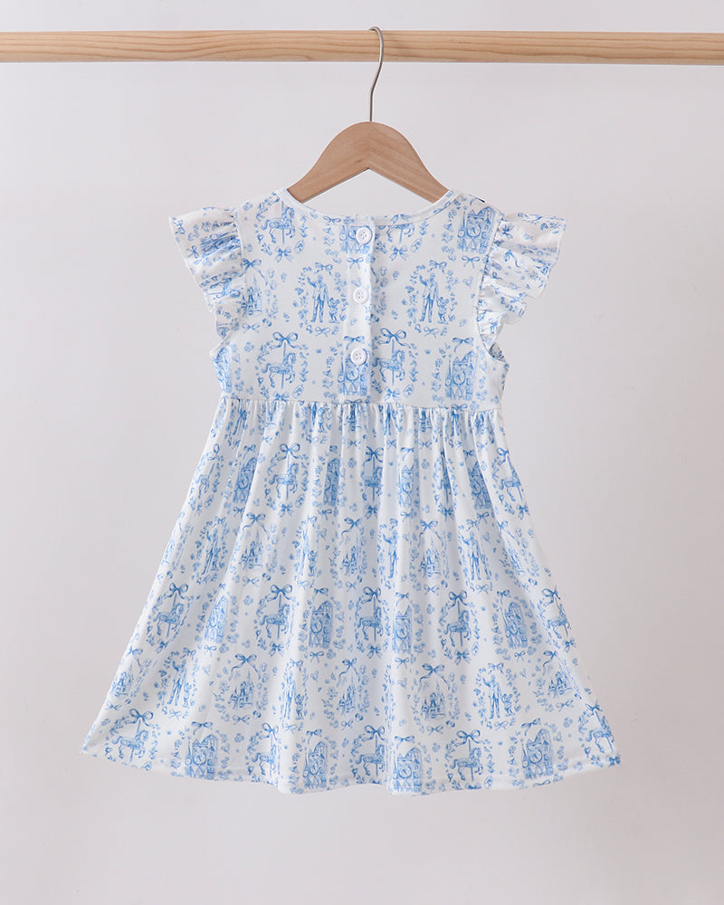 Floral dress hanging on a wooden hanger against a plain background