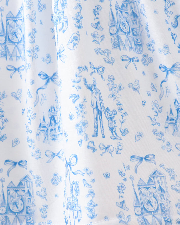 White fabric with blue vintage-style pattern featuring people, clocks, and bows.