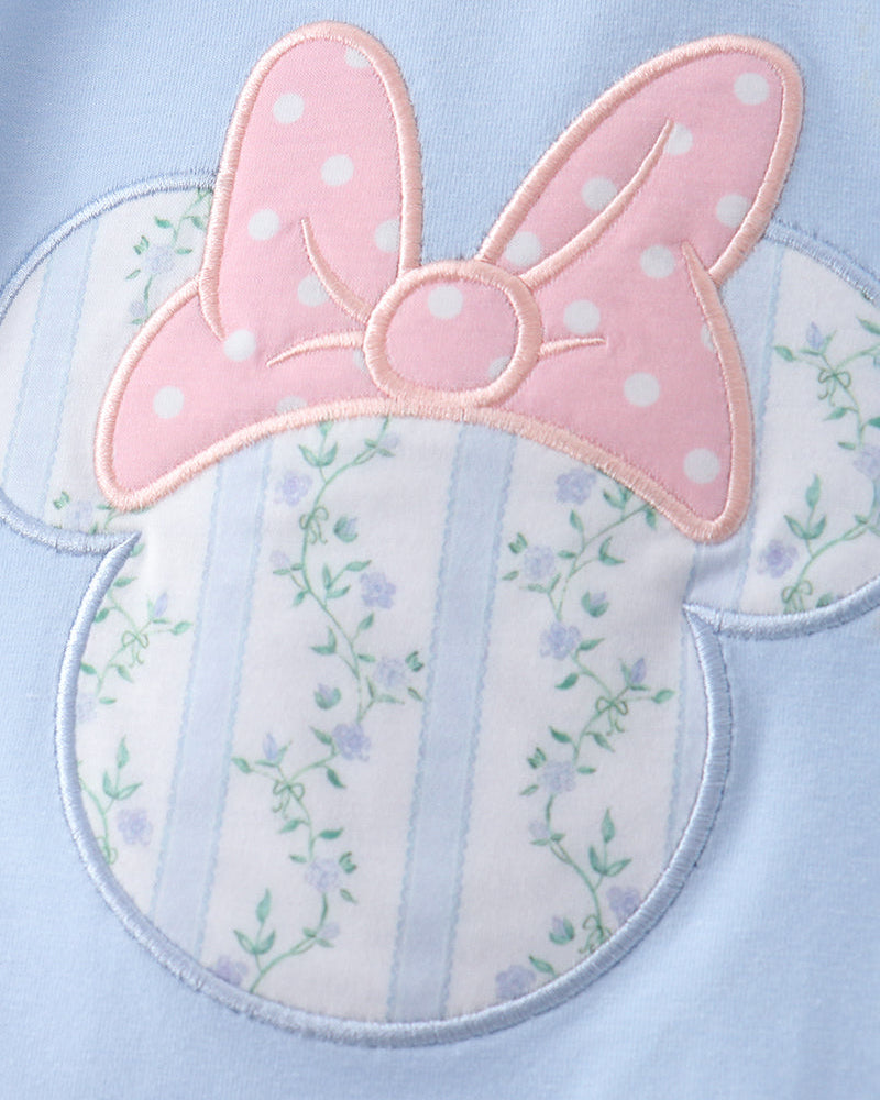 Light blue fabric with a pink bow and floral design