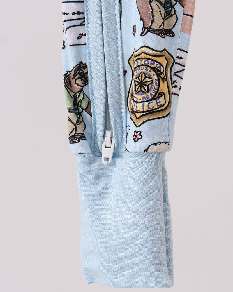 Light blue bamboo romper with front opening and character paw-print graphic