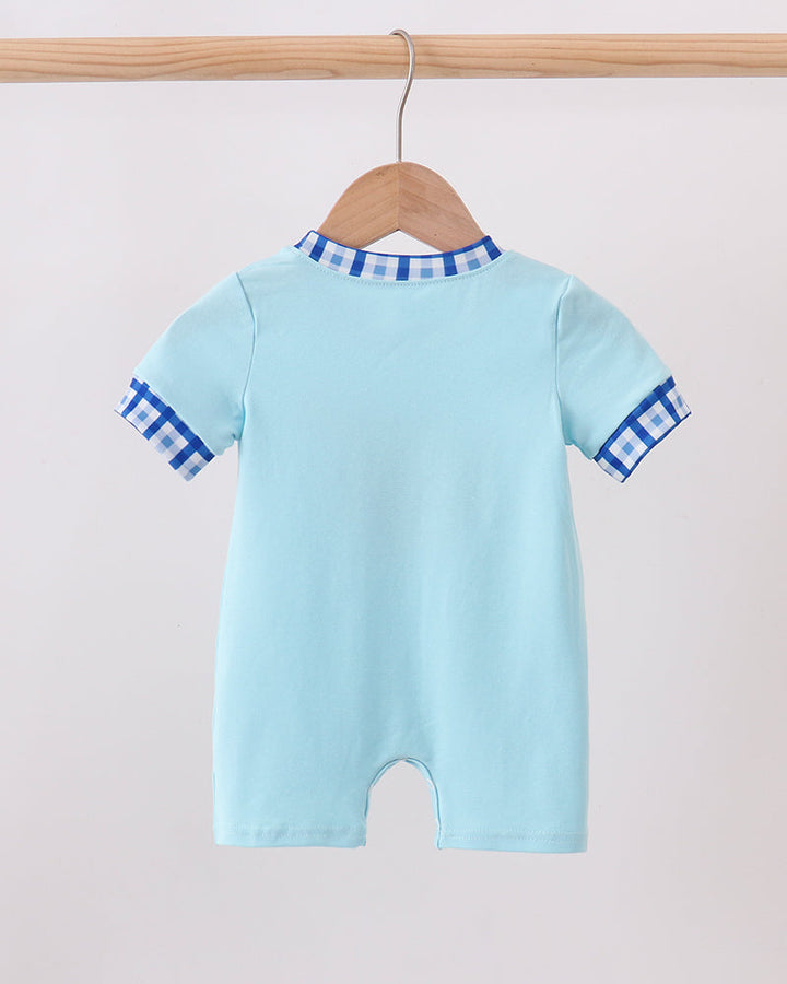 Light blue romper with plaid yoke and short sleeves embroidery detail