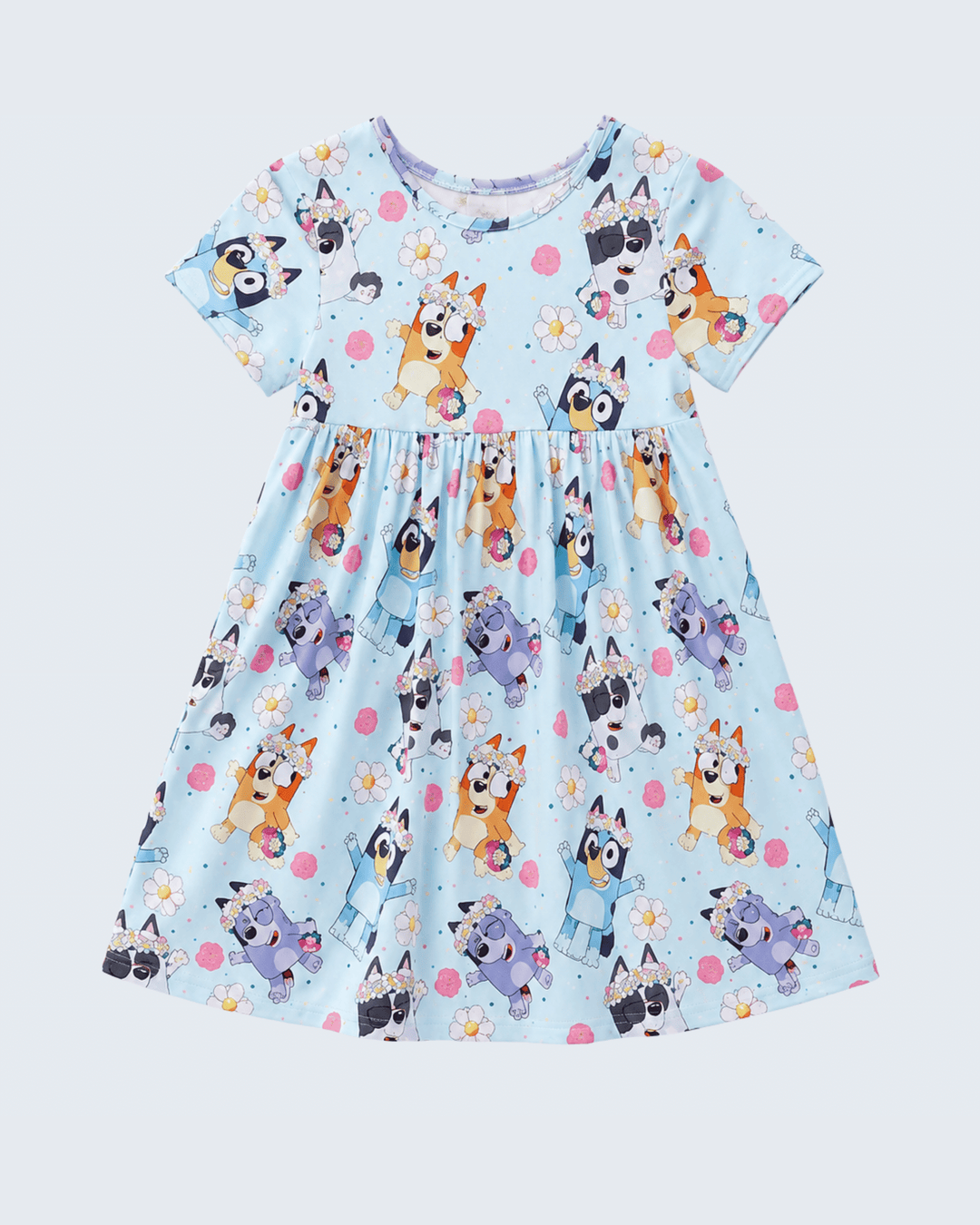 Children's dress with dog pattern on a light blue background