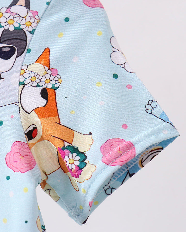 Dress with cartoon dog design on a light blue background