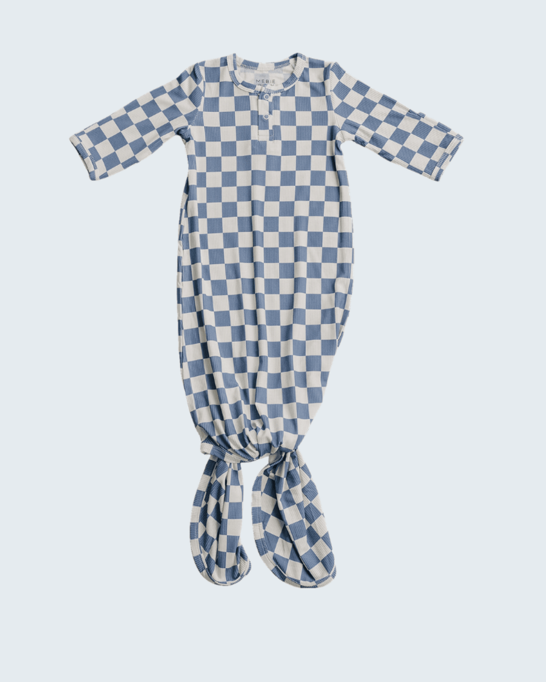 Blue and white checkered baby gown on a light blue background