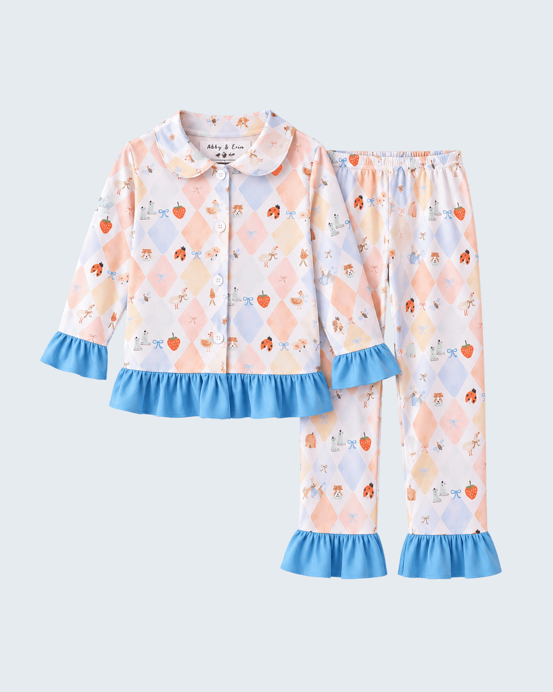 Kids bamboo pajama set with blue ruffle cuffs, button shirt and printed pajama pants