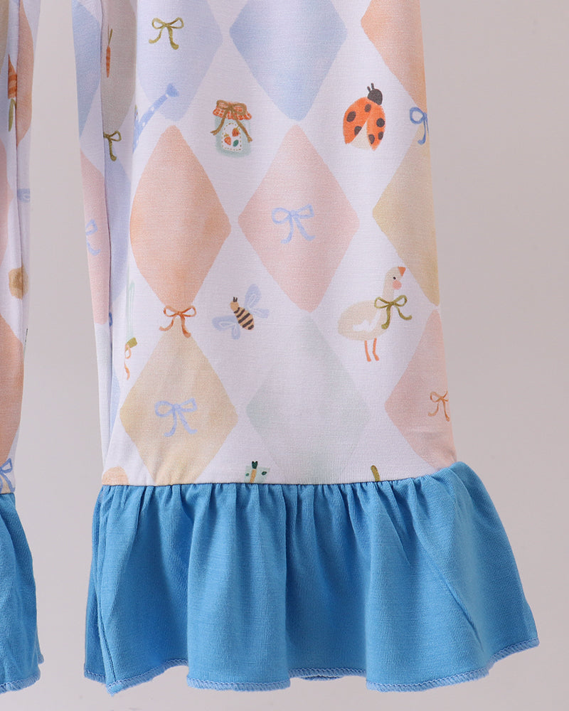 Pastel diamond print pajama pants with fruit-and-bow detail and blue ruffled hem