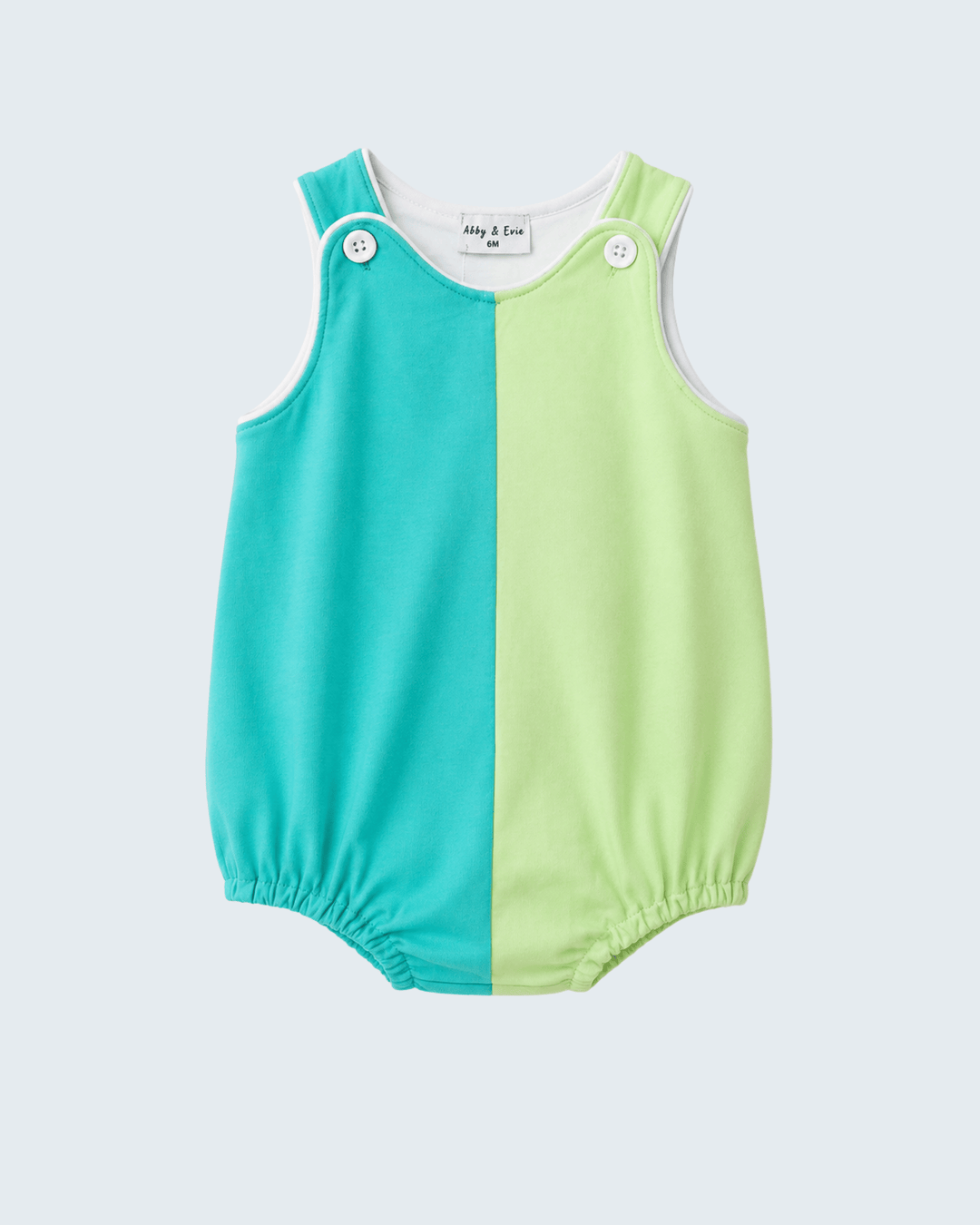 Two-tone turquoise and green baby romper on a light gray background