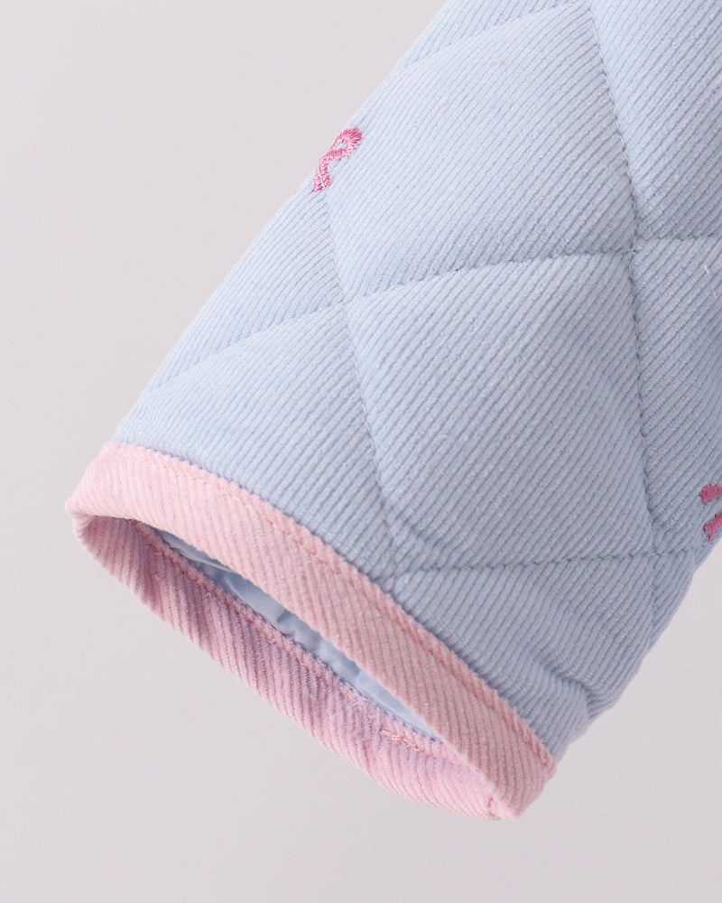 Light blue quilted jacket sleeve with pink ribbed cuff