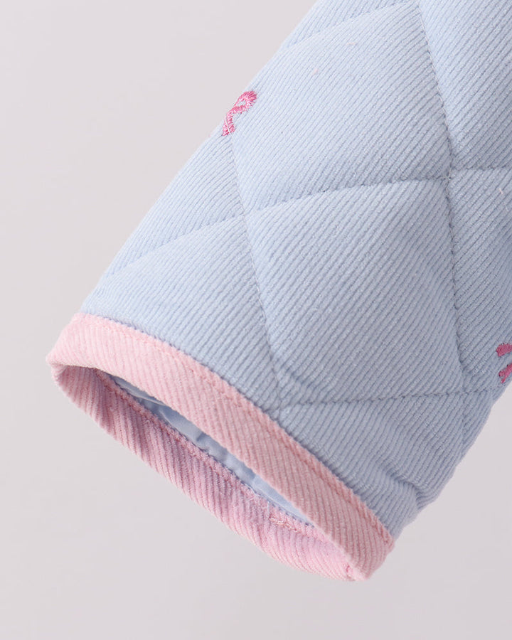 Light blue quilted jacket sleeve with pink ribbed cuff