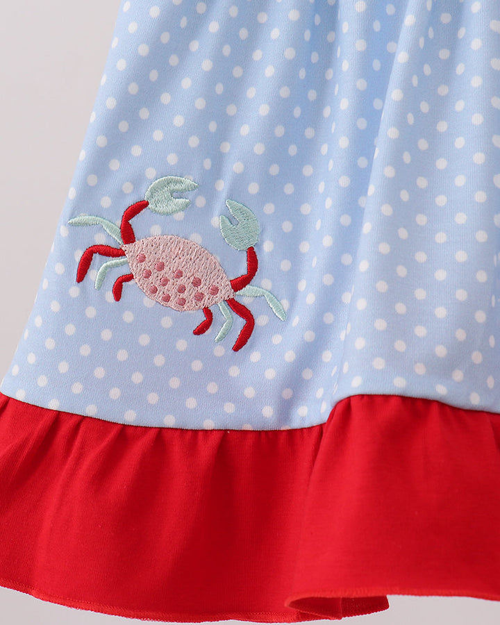 Blue polkadot dress with a crab embroidery