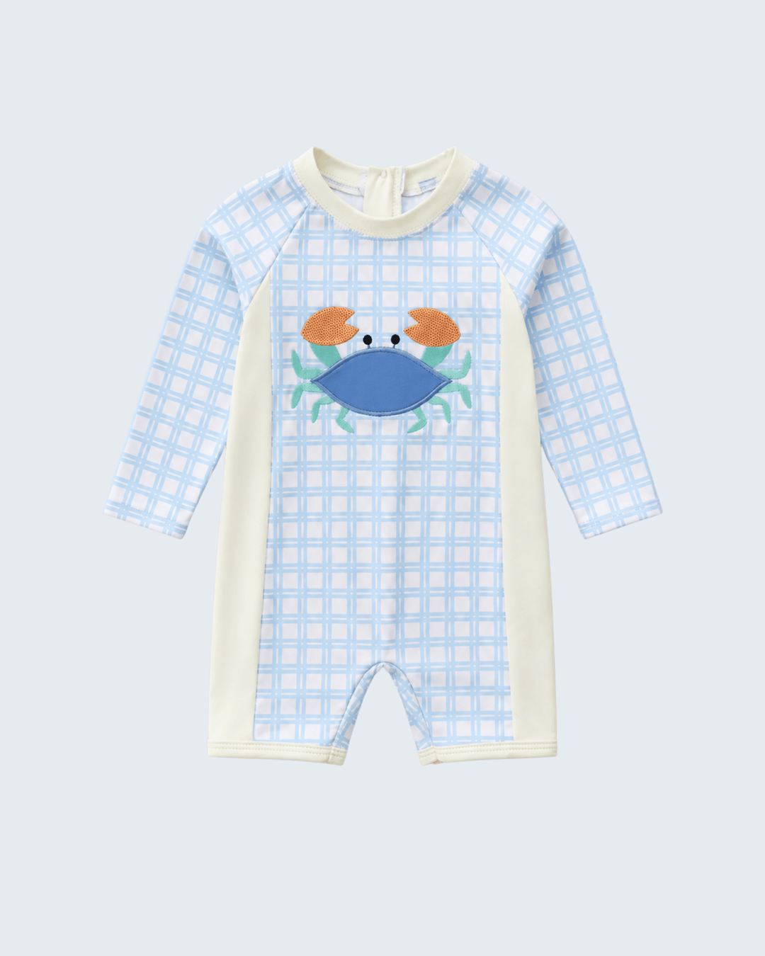 Swimsuit with blue checkered pattern and crab design on a light gray background